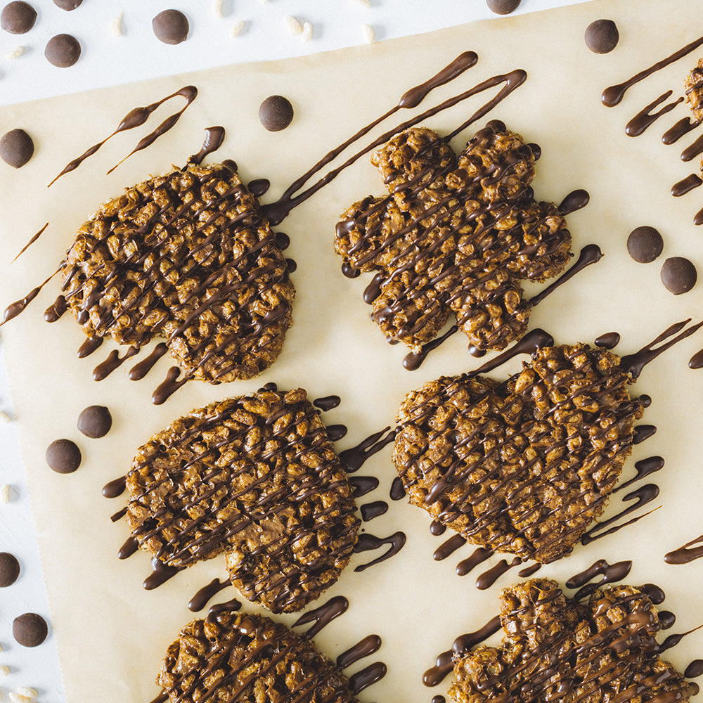 Crispy chocolate puffed rice treats in heart and flower shapes, drizzled with chocolate