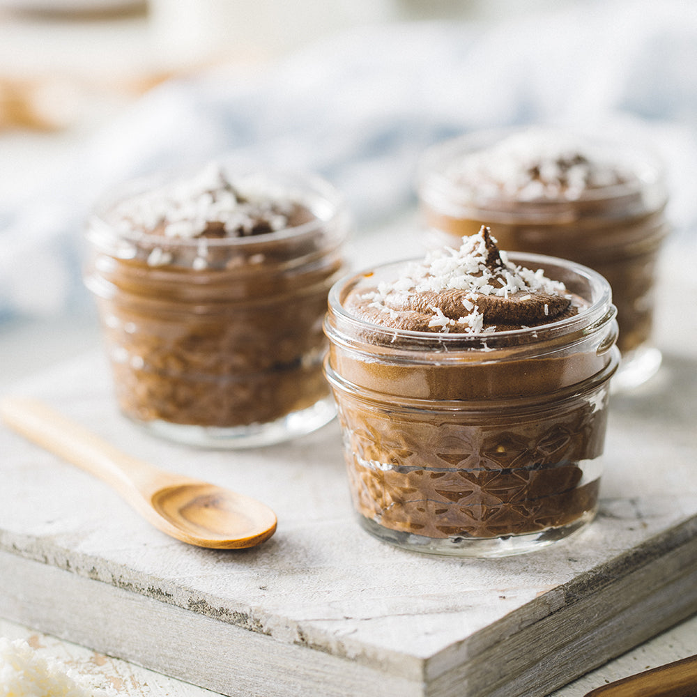 Dark Chocolate Mousse Cups in Glass Jars with Shredded Coconut on top