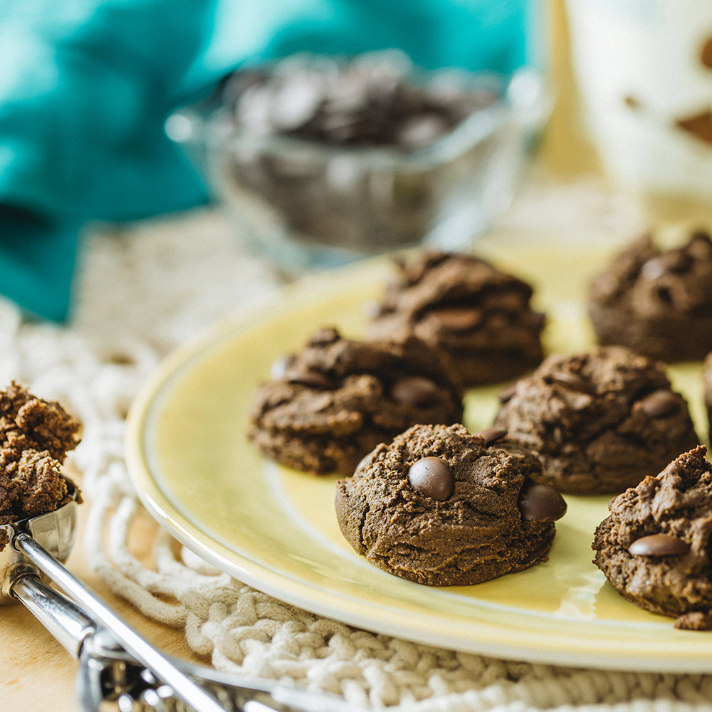 Double chocolate chip cookies on yellow plate on a late summer day