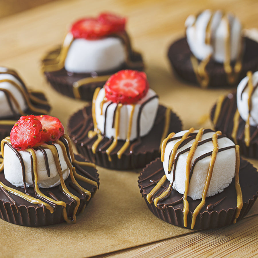 Chocolate Sun Cups Topped with Dandies Marshmallows, Sliced Strawberries and Drizzled With Chocolate and Sunbutter