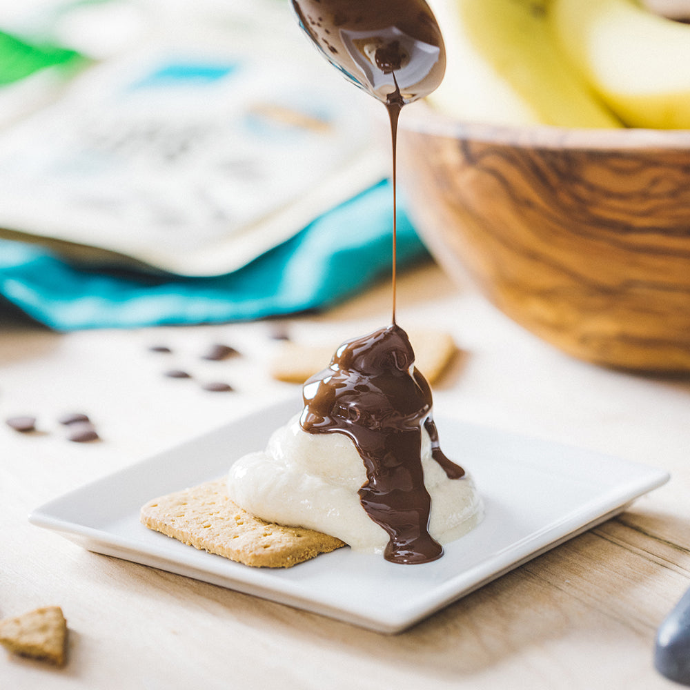 Graham Cracker topped with Vegan Banana Cream and Drizzled Melted Chocolate