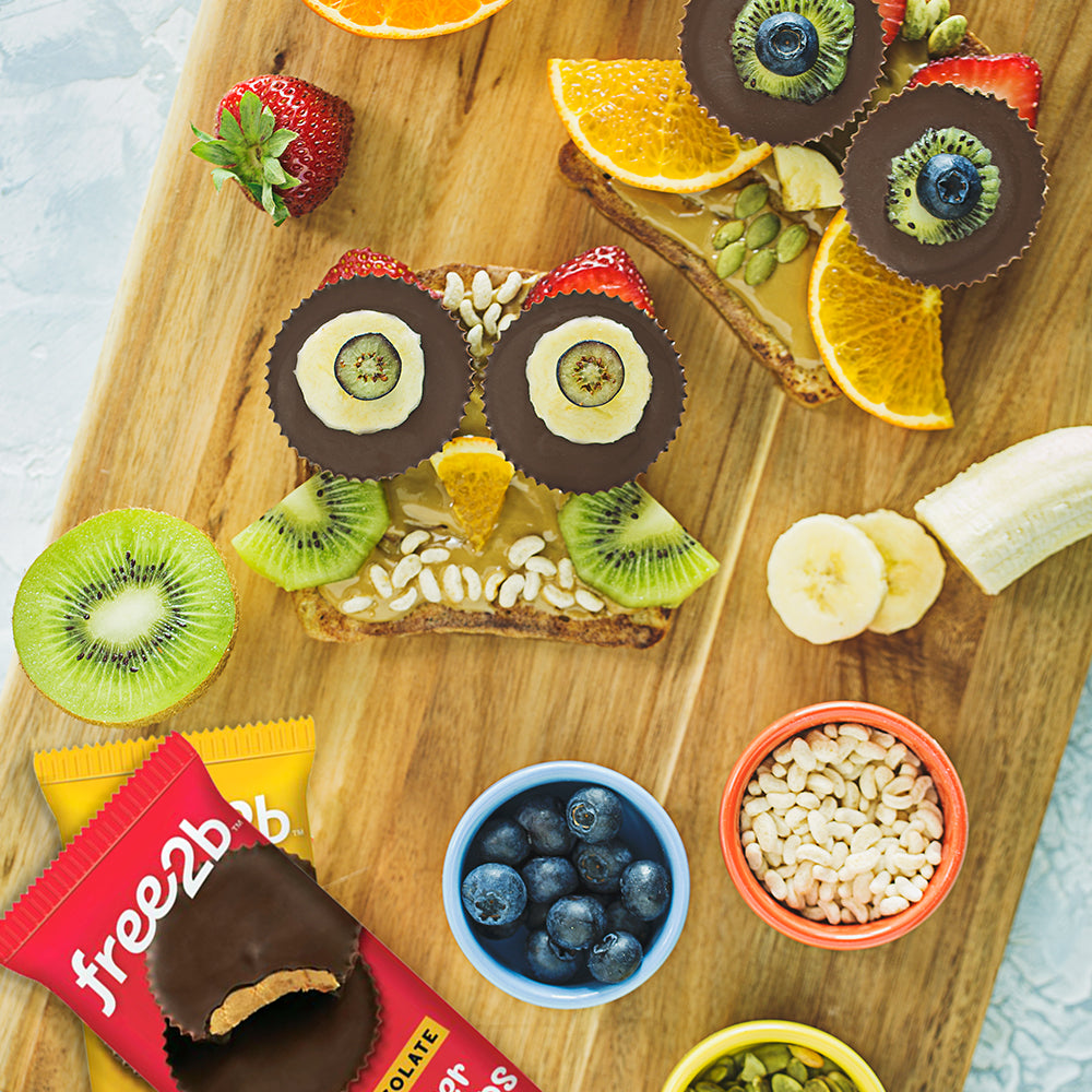 Egg-Free French Toast Decorated With kiwis, seeds, Chocolate Sun Cups and more to look like an owl