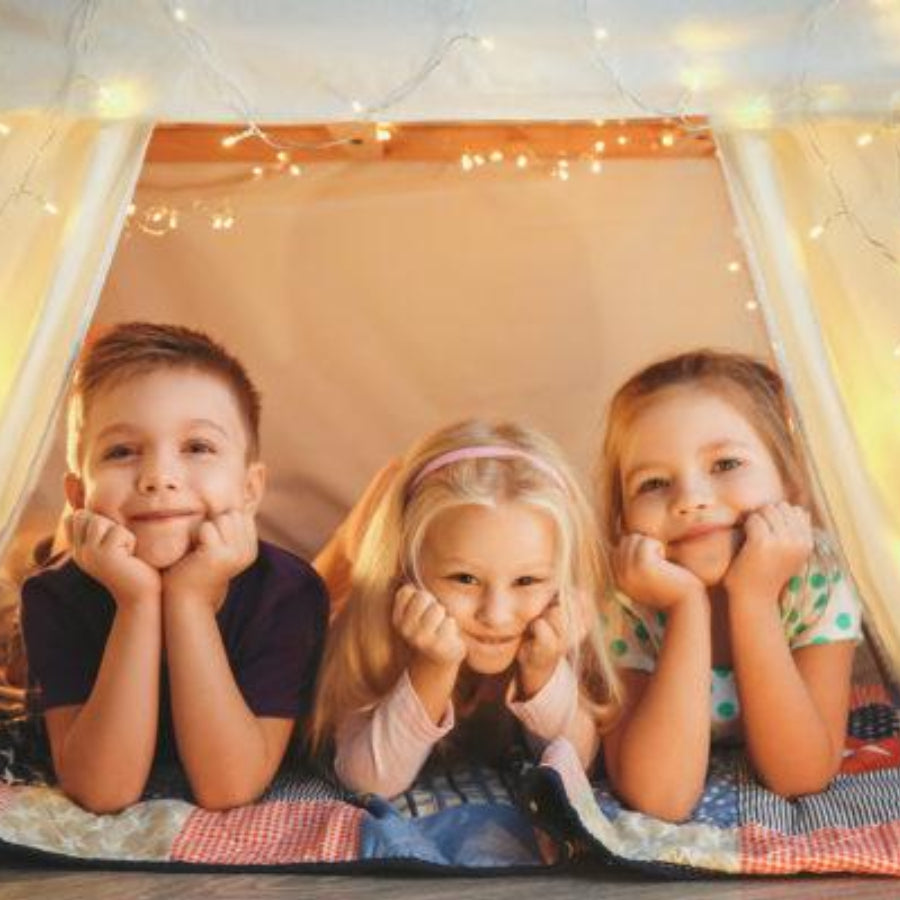 Kids Under Home Made Blanket Fort